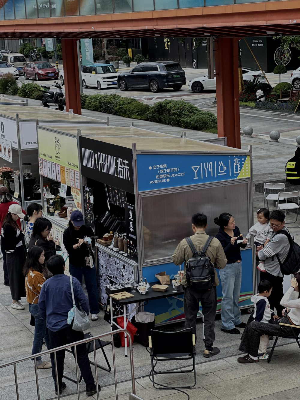 Crowd at the UNDER x PERFUME market stand in Chengdu