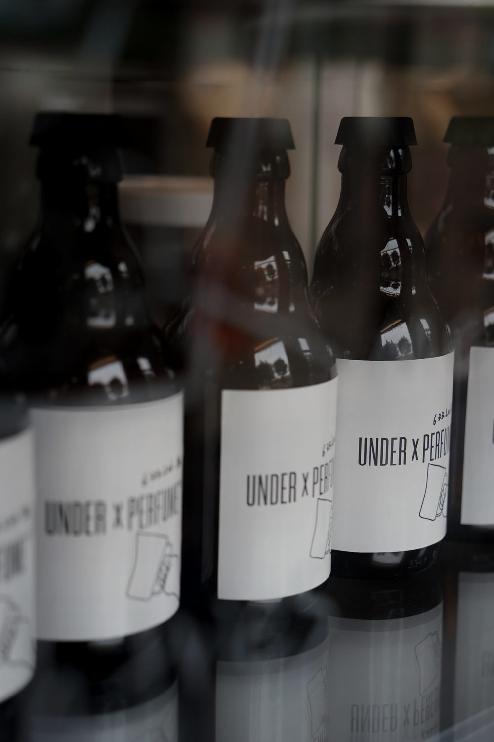 UNDER x PERFUME bottled drinks in the store display